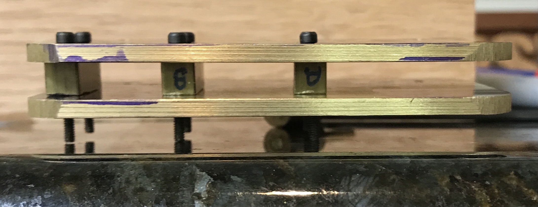 The three bearings between the two plates